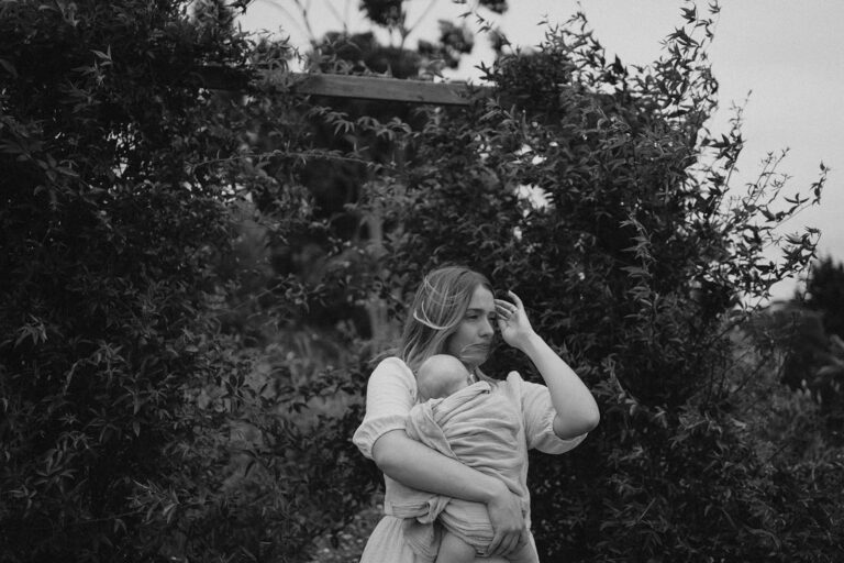 A black and white image of a mother with her newborn in Warrandyte
