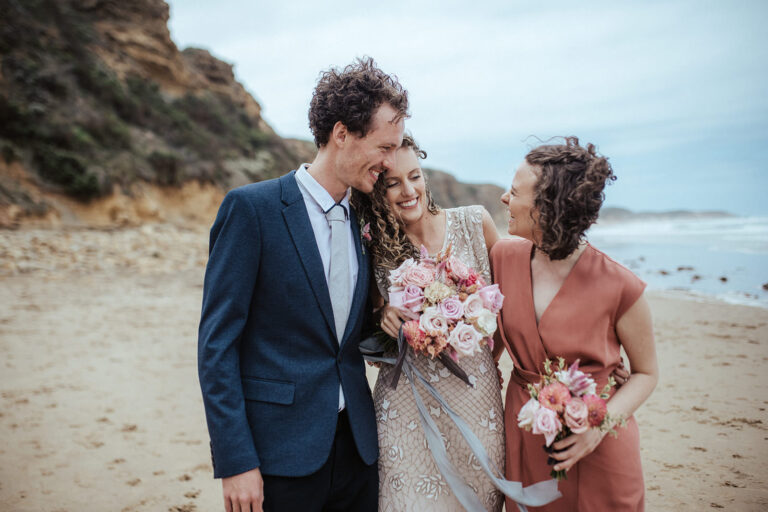 a photo of three siblings at a wedding on a beach near Mt Duneed Estate, VIC