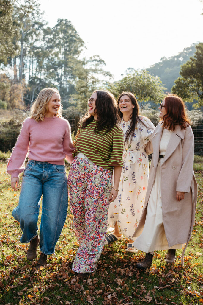 four women in colourful clothing for womens clothing store Cicely walk and laugh towards camera in Melbourne