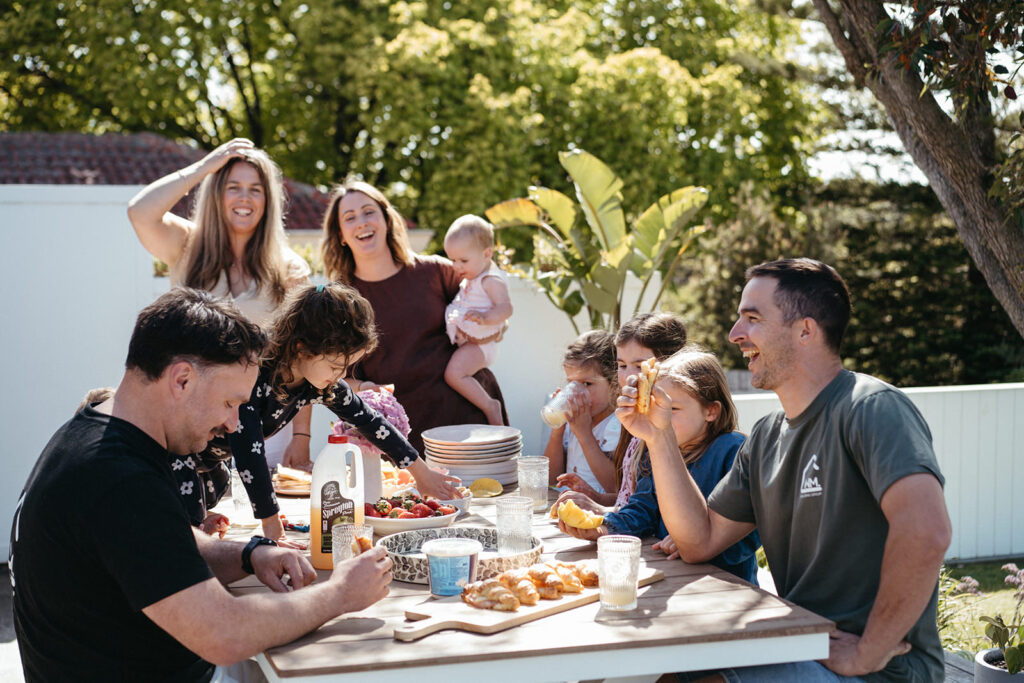 A two family run business laugh at a picnic table