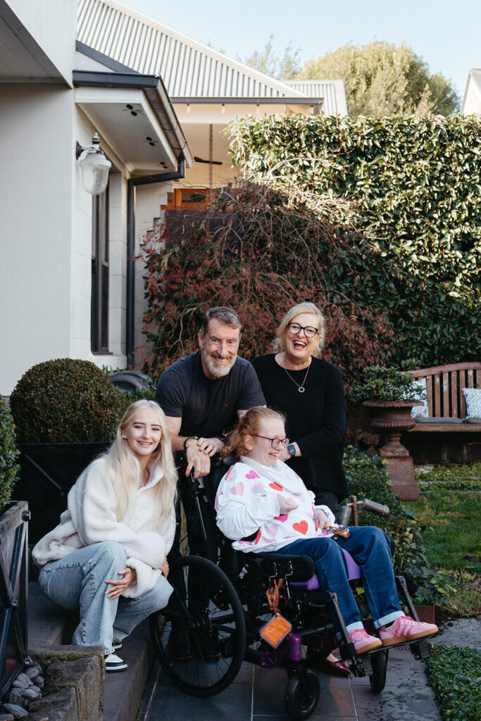 Family of four one child with a disability in wheelchair 