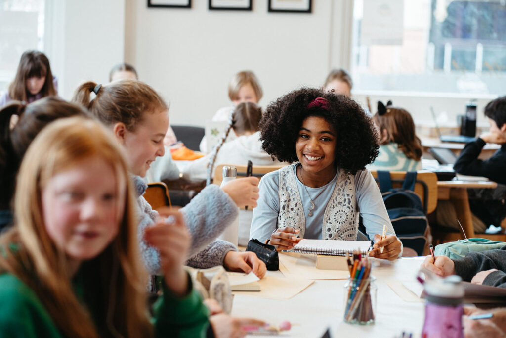 image of a girl writing during a class photos taken to market a writing class in Melbourne