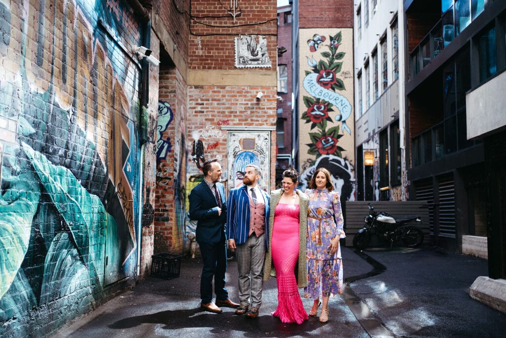 registry office wedding in melbourne laneways, brightly coloured wedding party of four in a melbourne laneway